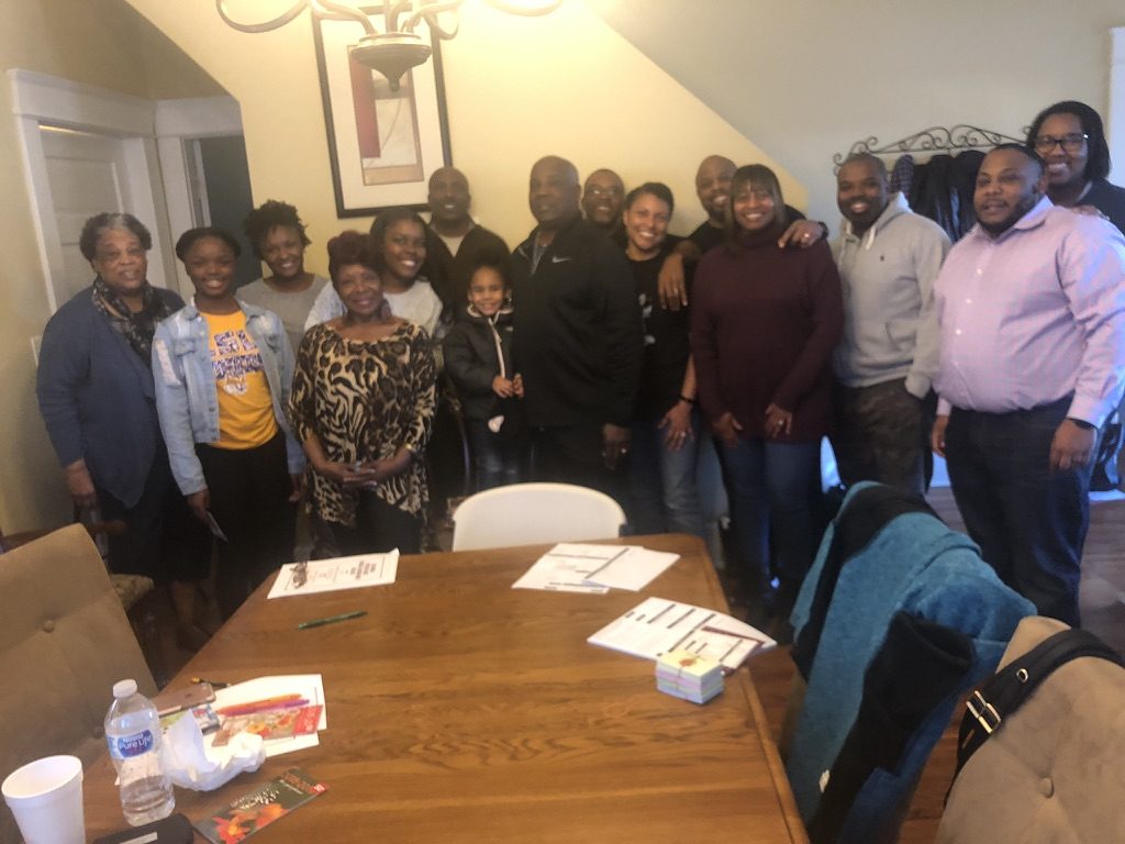 A family together around the table at the Annual Family Seminar